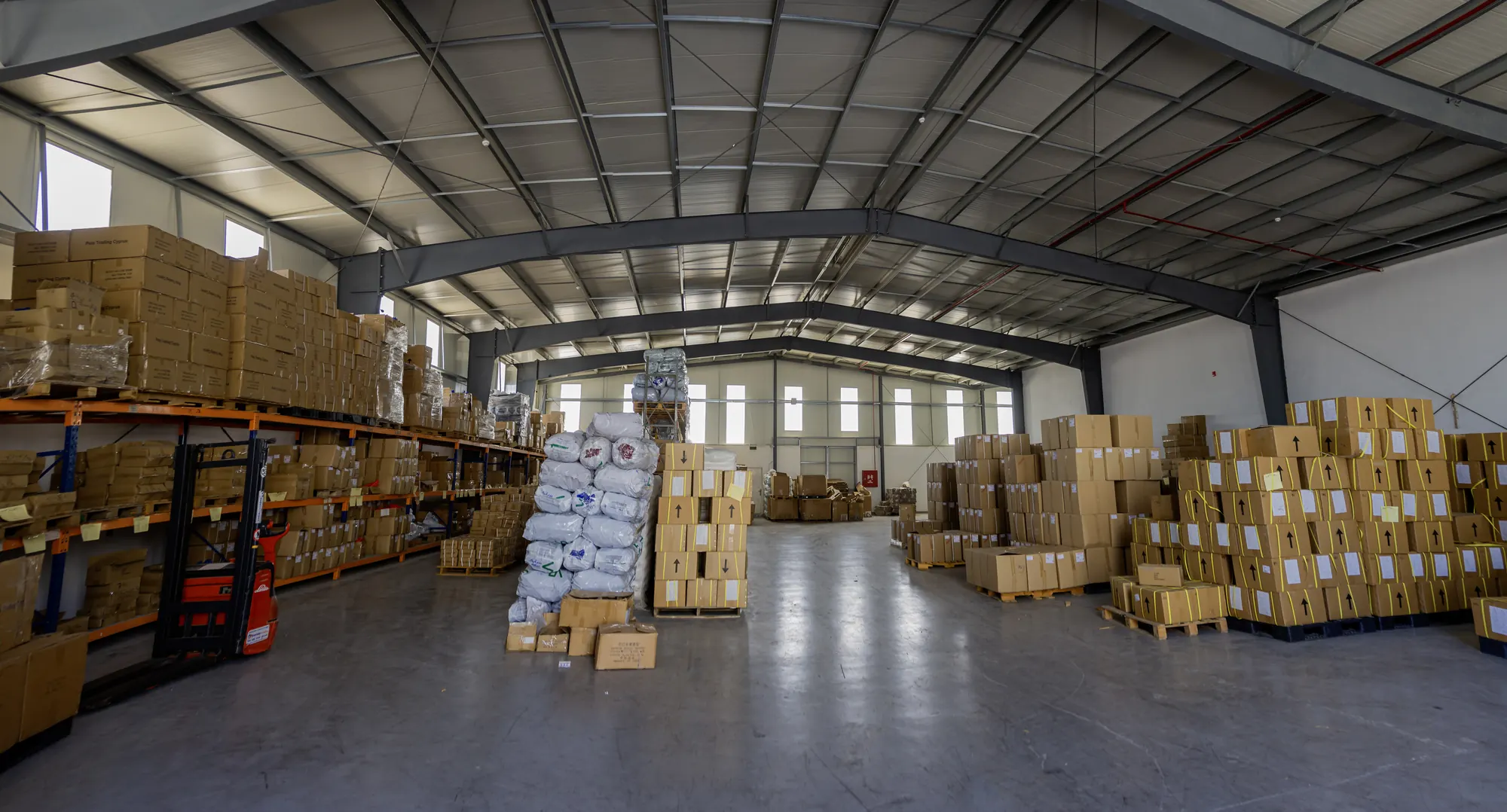 PETA's export warehouse, with pallets of boxed brushes and rollers ready to ship